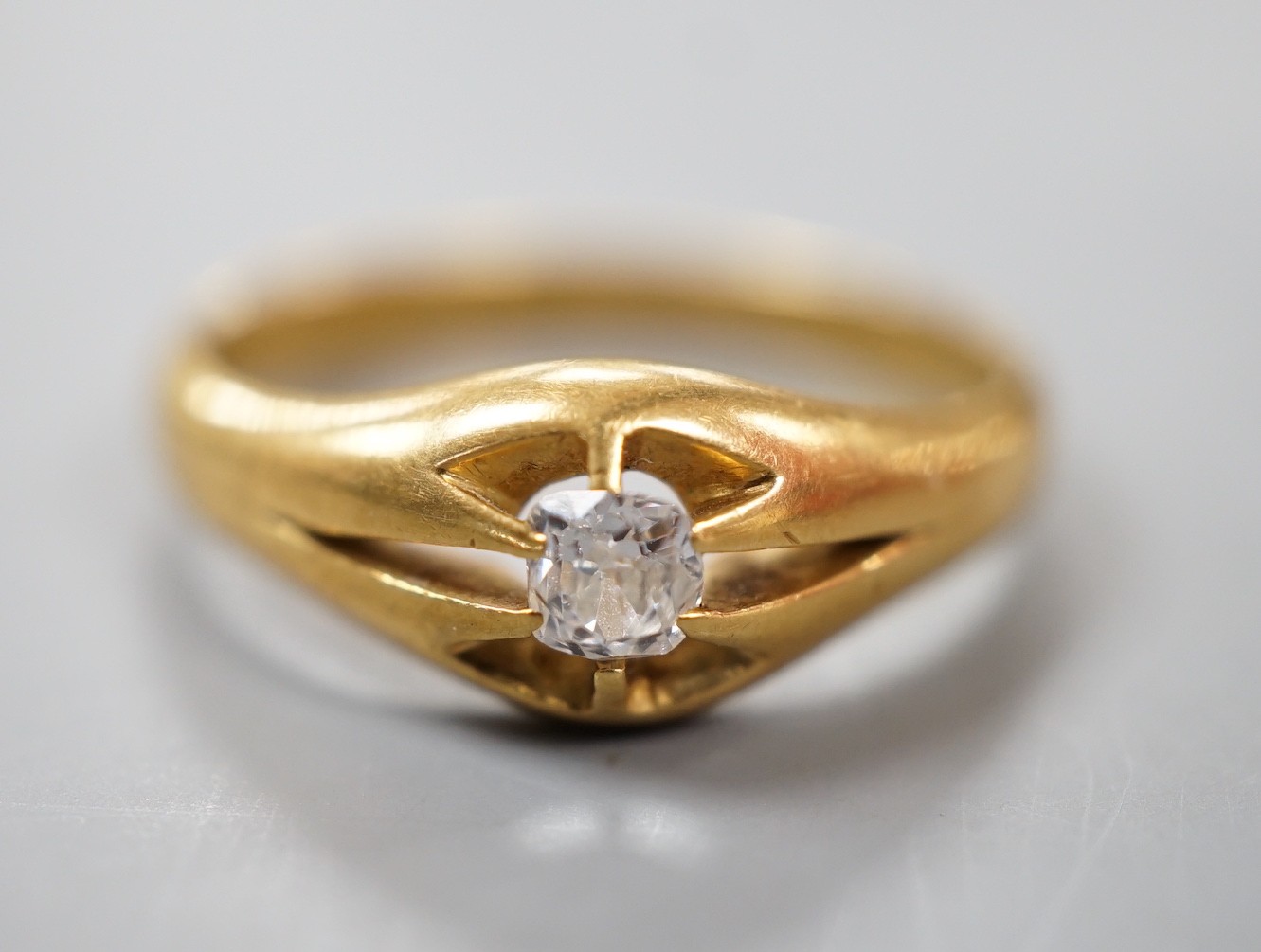 A late Victorian 18ct gold an claw set solitaire diamond ring, size Q, gross weight 5.2 grams.